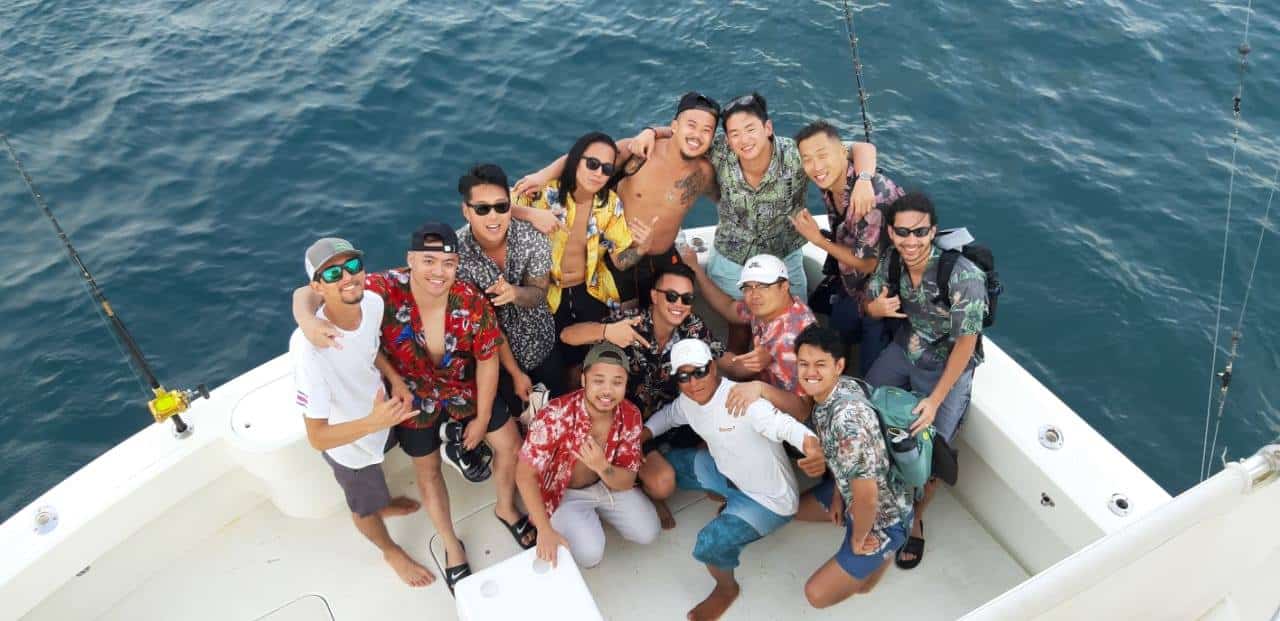 Friends having fun on a party boat in Jaco